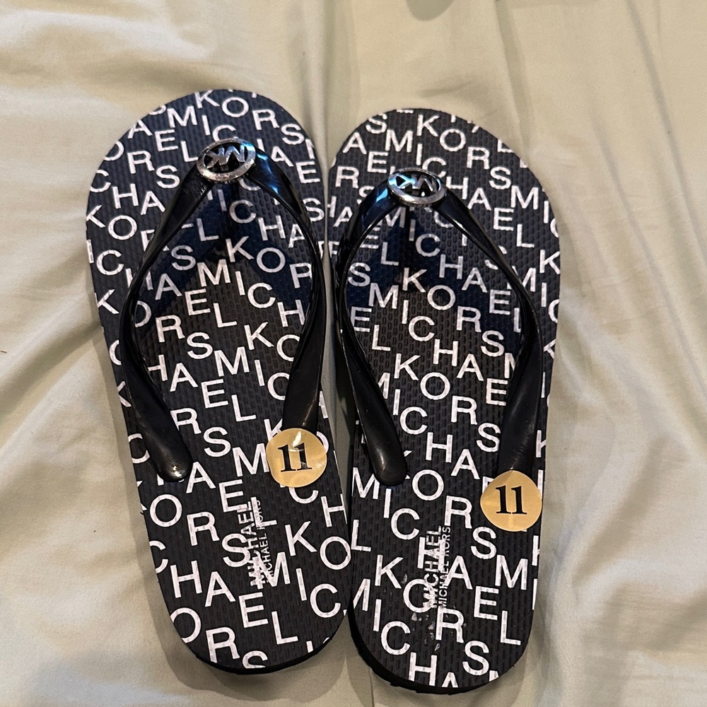 Michael Kors Black and White Logo Flip Flops with Gold Accents